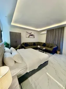 C Studio with a large sitting area and a double bed, self check-in C - Image 5