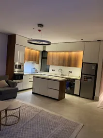 A hotel apartment with three bedrooms, a kitchen, three bathrooms, and a home theater room. - Image 3