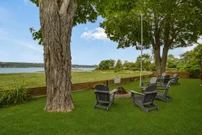 The waterfront suite • Covered Terrace & Fireplace - Image 5