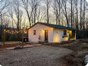 Charming brick cottage in a serene setting. - Image 2