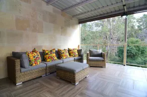 Coastal family retreat sun-drenched outdoor patio - Image 4