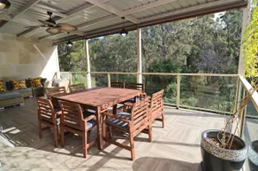 Coastal family retreat sun-drenched outdoor patio - Image 3