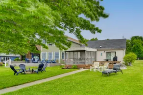 Porch + Views: Waterfront Home on Houghton Lake! - Image 4