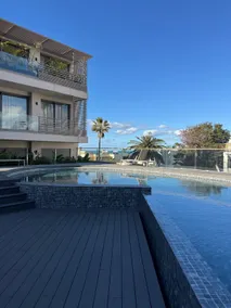 Premium Apartment by the Beach with Pool & Parking - Image 5