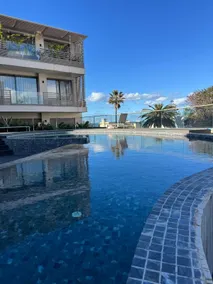 Premium Apartment by the Beach with Pool & Parking - Image 2
