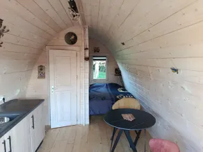 A small, comfortable cabin in a village. - Image 2
