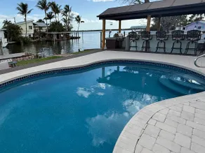 Relaxing waterfront retreat with pool - Image 2