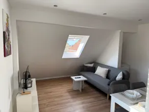 Stylish attic apartment with box spring bed - Image 3