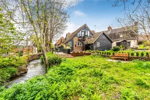 Modern & Historic Mill Flat with Stream Views - Image 3
