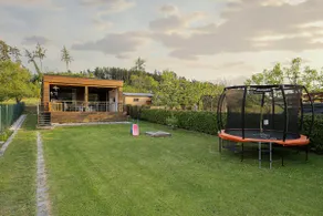 Modern cottage with large covered terrace by pond - Image 2