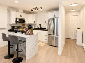 Modern 2BR Suite Parking Laundry - Image 4