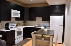 Private 2BR Suite | Kitchen & Laundry - Image 2