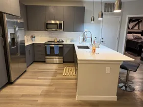 Downtown Skyline Escape| Modern Mid-rise Apartment - Image 3