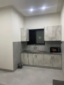 Modern 1BHK Apartment with Kitchen and Dining Area - Image 5
