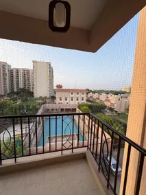 A calm Top-floor 2BHK with a pool-view balcony - Image 3