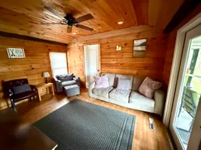 Experience the charm of a rustic lakefront cottage, perfect for year-round fun! - Image 5
