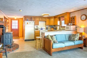 Scenic Lyman Home on Swan Pond w/ Wraparound Deck! - Image 4