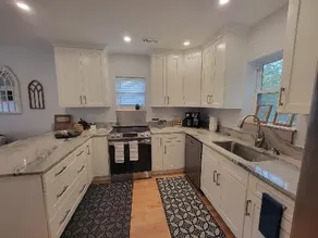 Centrally located, pristine, creekside home. - Image 3