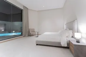 Villa F with a modern design, pool, and outdoor seating in Al-Amariyah - Image 4
