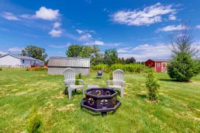 Relaxing 3BR home with a deck & firepit - Image 4