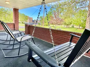 Park view • Porch swing • 2BA | Manchester Manor - Image 5