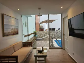 A house with a swimming pool, waterfall, grill, and artesian oven - Image 2