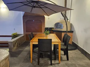 A house with a swimming pool, waterfall, grill, and artesian oven - Image 5
