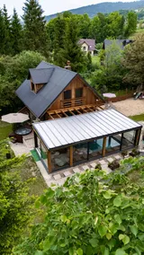 A year-round, covered, heated swimming pool and a hot tub. - Image 2
