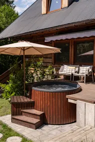 A year-round, covered, heated swimming pool and a hot tub. - Image 5