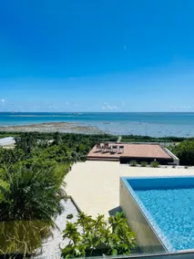 Experience the ultimate relaxation in a semi-open-air bath while taking in the stunning ocean view. - Image 4