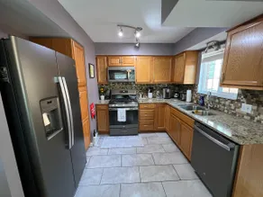 Spacious Two Bedroom Upper Unit with Kitchen - Image 2