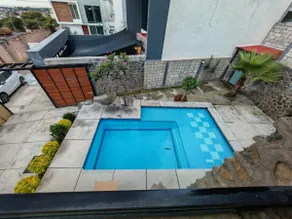A house with a heated pool - Image 4