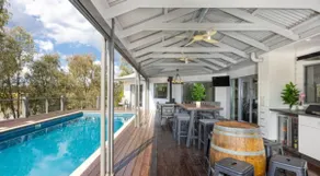 Lagoon-Side Retreat with Pool. Sleeps 10 2kms CBD. - Image 3