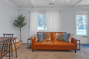 Near MSU • Elevated Deck • 65” TV • Pets. Book Now - Image 3