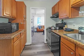 Near MSU • Elevated Deck • 65” TV • Pets. Book Now - Image 2