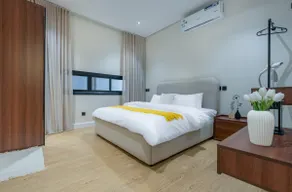 One bedroom and a living room with a modern design - Image 2