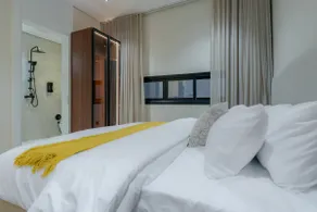 One bedroom and a living room with a modern design - Image 5