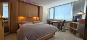 Bright room with private bathroom and market square view - Image 4