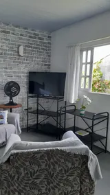 Room with a mini kitchen. - Image 2