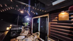 Casabella Jstay, a pretty, emotional, private pension with a garden/2-story wooden house with a blue lawn - Image 3
