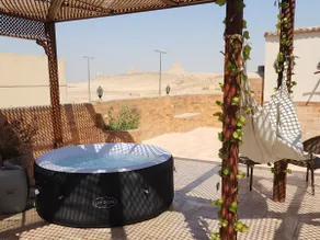 private rooftop with hot jacuzzi and pyramids view - Image 2
