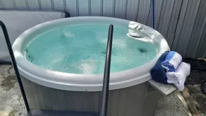 Adorable cottage retreat. Unwind in the private hot tub, enjoy a BBQ, and 🔥 pit - Image 3
