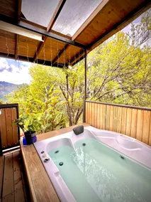 Jacuzzi on a covered deck with mountain views - Image 5