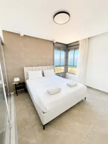 Bright 3BR w Large Terrace & Sea View l Mamad - Image 3