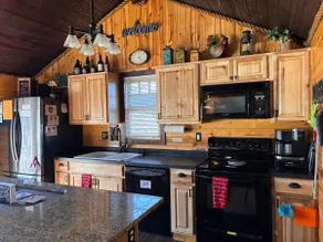 Cozy 4BR 2BA Cabin in Town near Trails. Fire Pit+ - Image 4