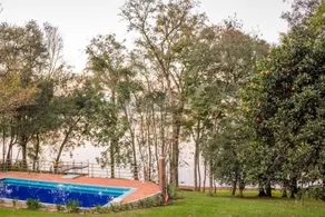 Lake house with swimming pool integrated into nature - Image 2