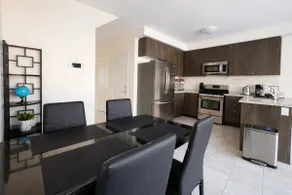 KoziNest Smart 2BR Home—Near Shops, Dining & Beach - Image 3