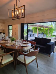 Casa T'ähi · Under the big tree, firepit and pergola - Image 2