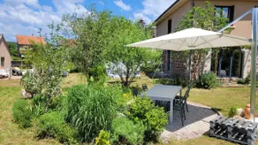 A family home with a landscaped garden - Image 4
