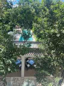 Bright Modern 2BR at TAO | Pools, Gym, Fast WiFi - Image 5